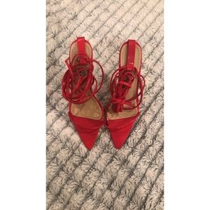 Red pointed-toe heels